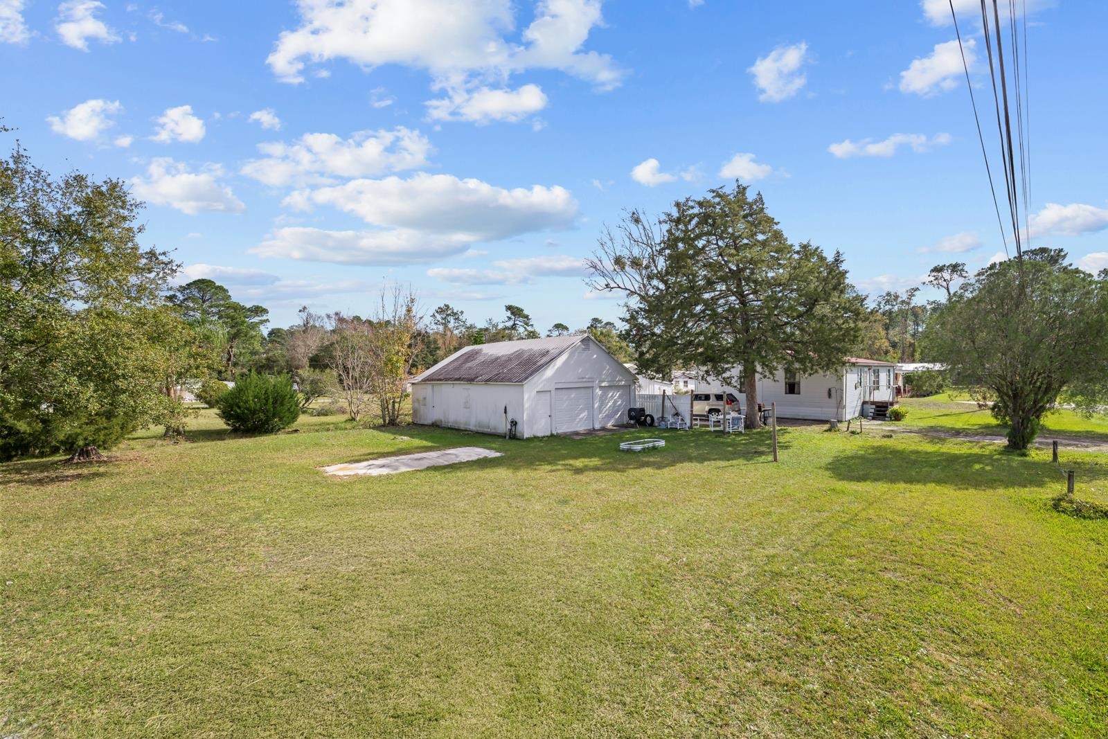 106 Lake Lane Crescent City, FL 32112 - Photo 25 of 25 a swimming pool with some trees in the background