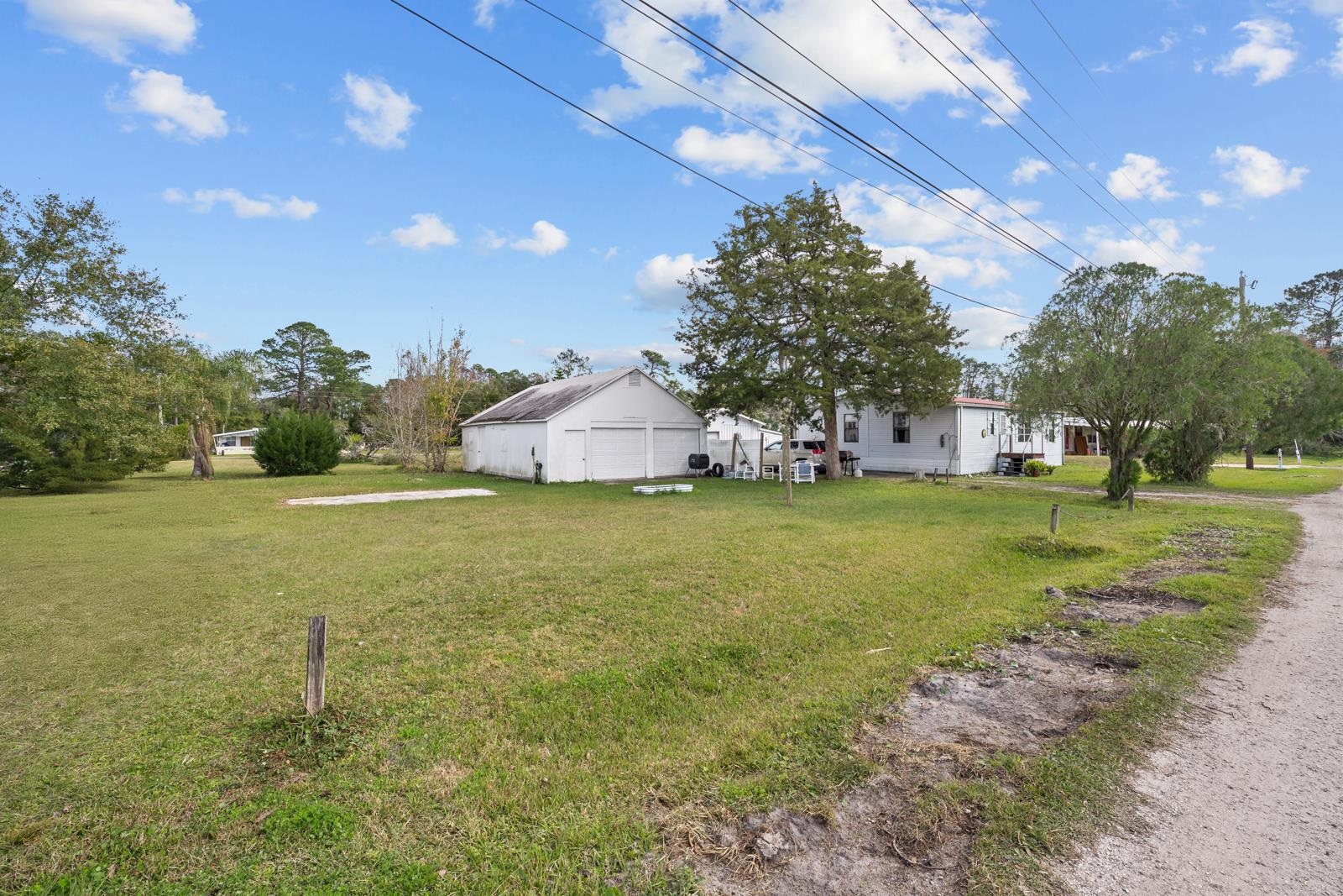 106 Lake Lane Crescent City, FL 32112 - Photo 3 of 25 a view of an house with backyard space and garden
