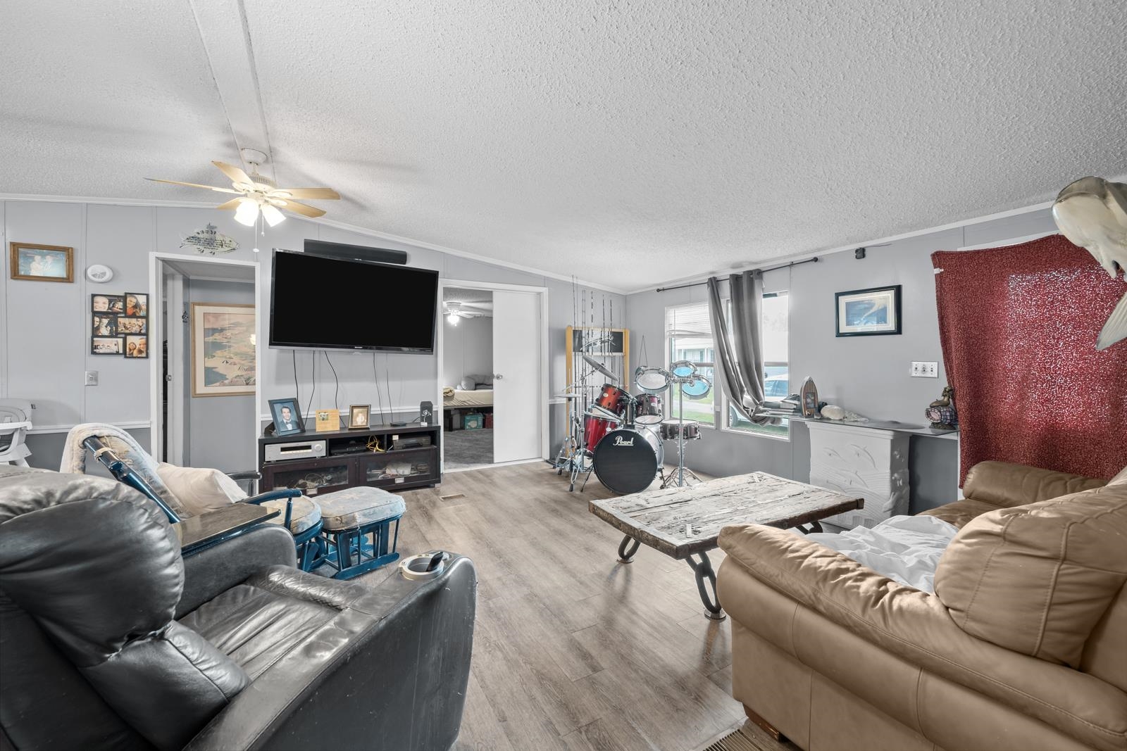 106 Lake Lane Crescent City, FL 32112 - Photo 4 of 25 a living room with furniture a dining table and a flat screen tv