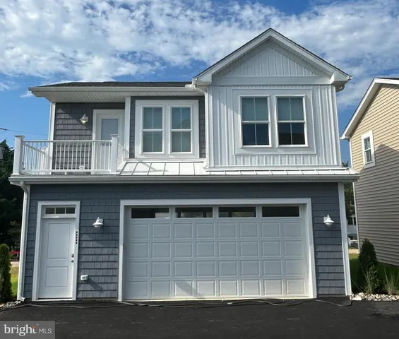 a front view of a house with a garage