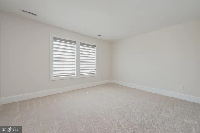 a living room with furniture a table and a large window