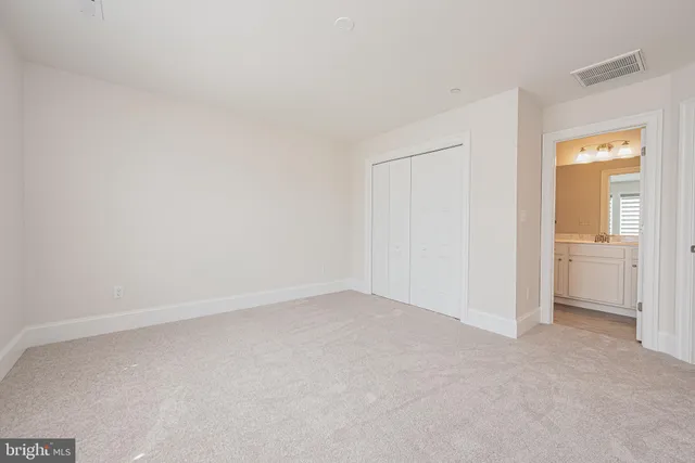 a kitchen with stainless steel appliances a refrigerator and a stove top oven