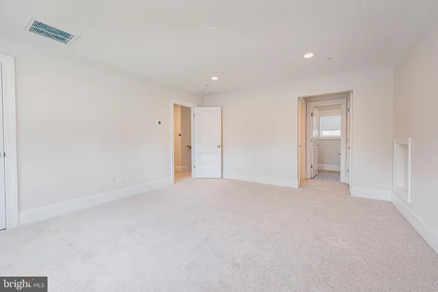 a kitchen with stainless steel appliances kitchen island granite countertop a sink and cabinets