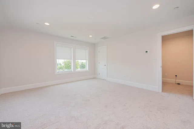 a large kitchen with stainless steel appliances lots of counter space and a sink