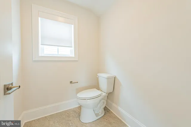 a large kitchen with stainless steel appliances lots of counter space and a sink