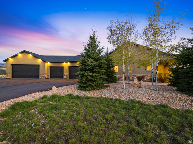 402 Shadow Hill Road Wanship, UT 84017 - Photo 80 of 90 View of front of property with stone siding, an attached garage, and driveway