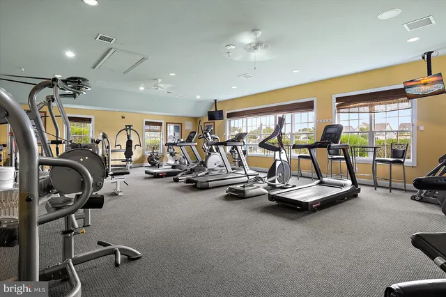 a kitchen with white cabinets and appliances