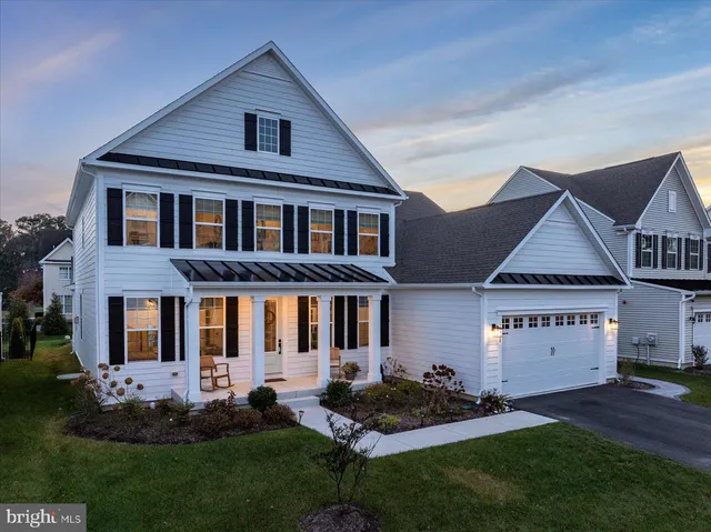 a view of a patio with dining table and chairs