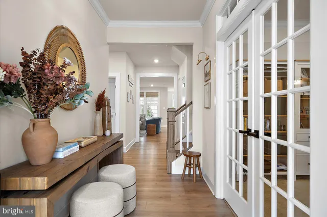 a front view of the house with potted plants