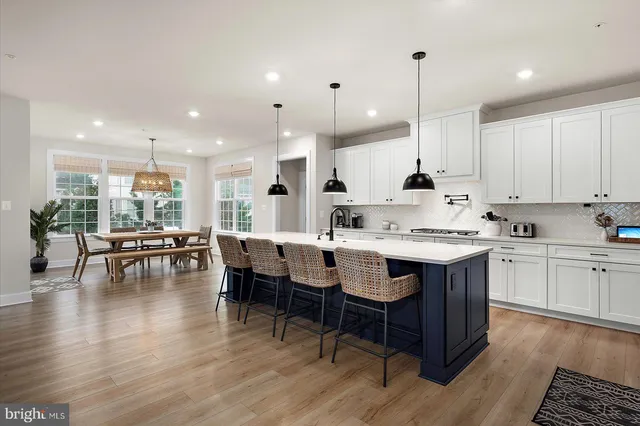 a view of a dinning table and chairs in the patio