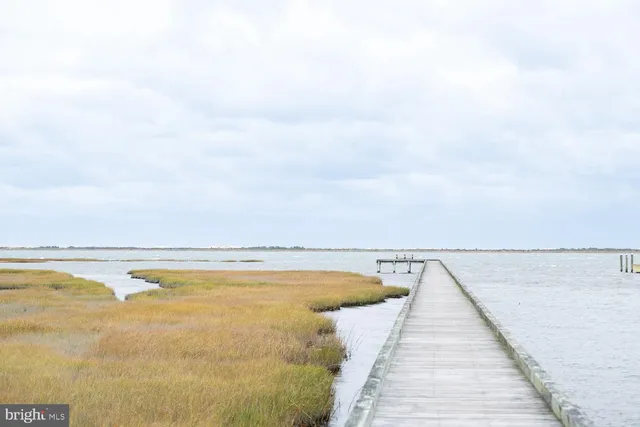 a view of swimming pool with an outdoor seating