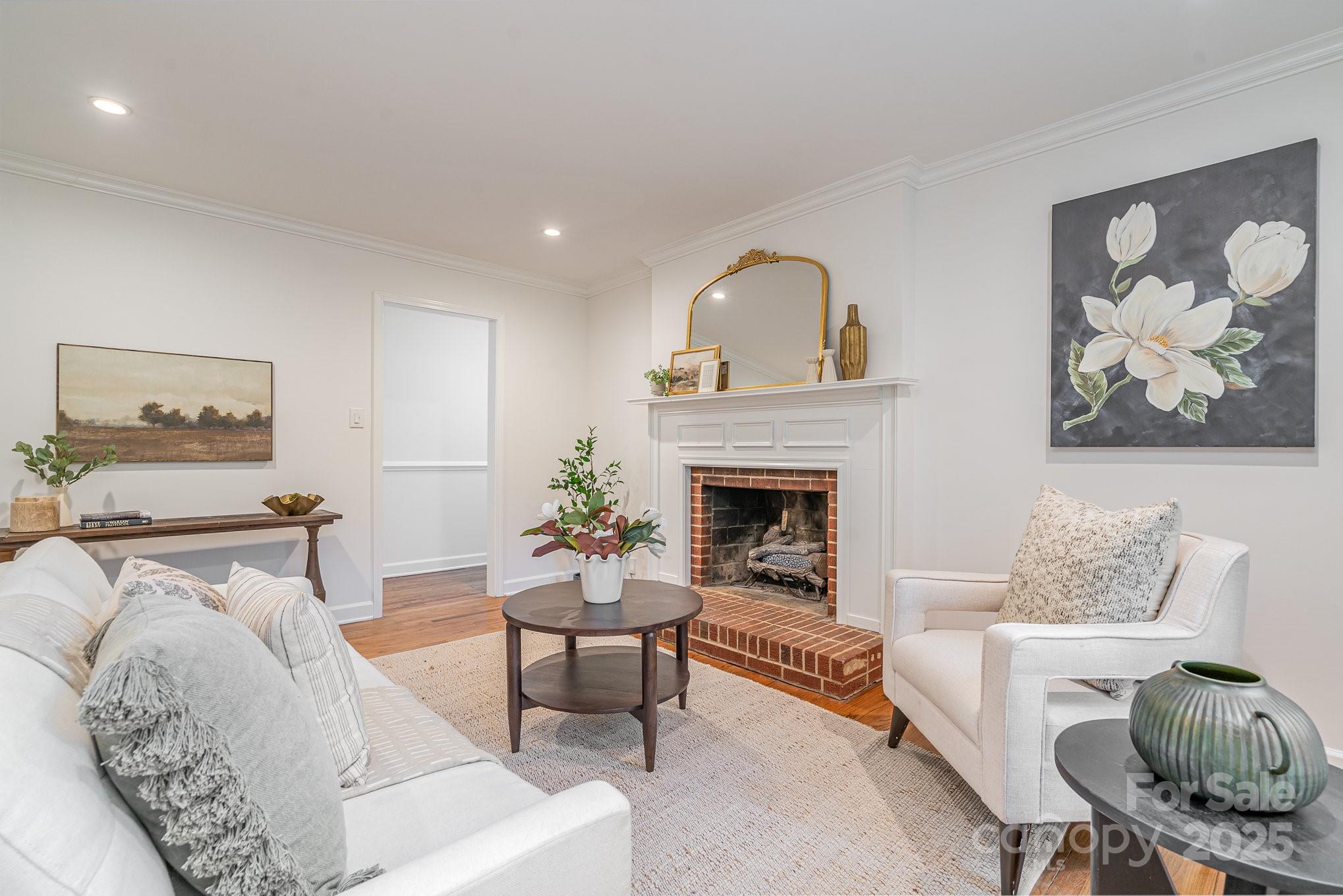 6749 Windyrush Road Charlotte, NC 28226 - Photo 14 of 30 a living room with furniture and a fireplace