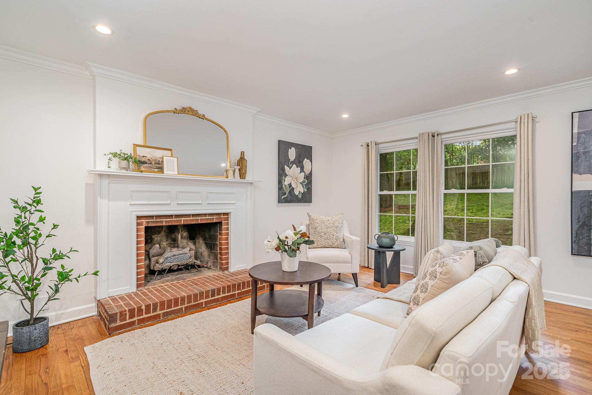 6749 Windyrush Road Charlotte, NC 28226 - Photo 15 of 30 a living room with furniture and a fireplace
