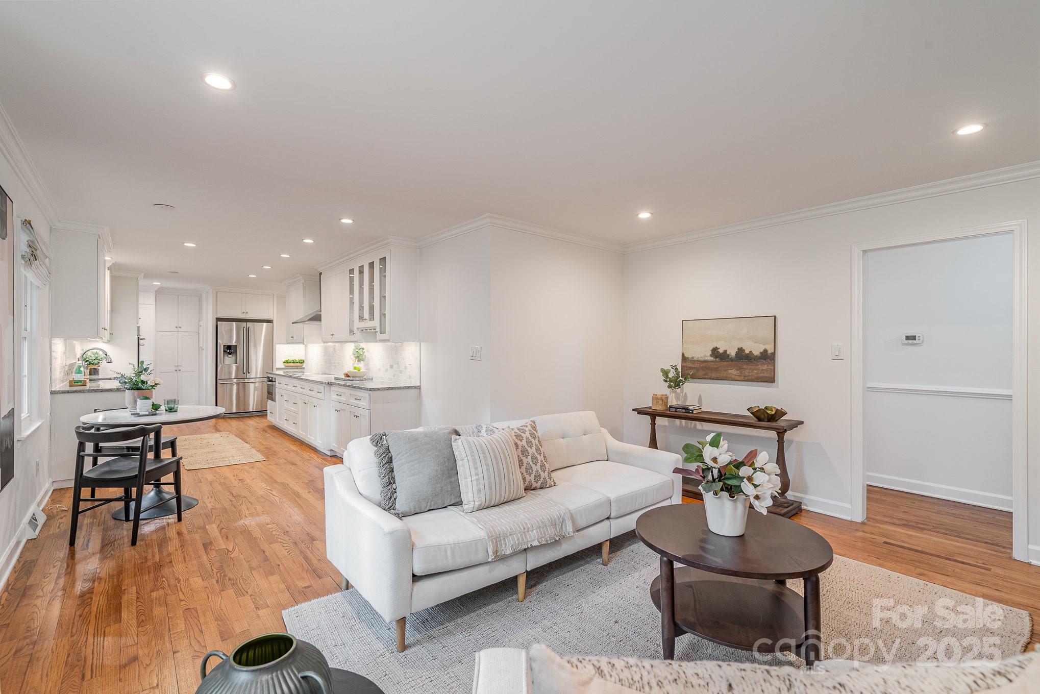 6749 Windyrush Road Charlotte, NC 28226 - Photo 16 of 30 a living room with furniture and wooden floor