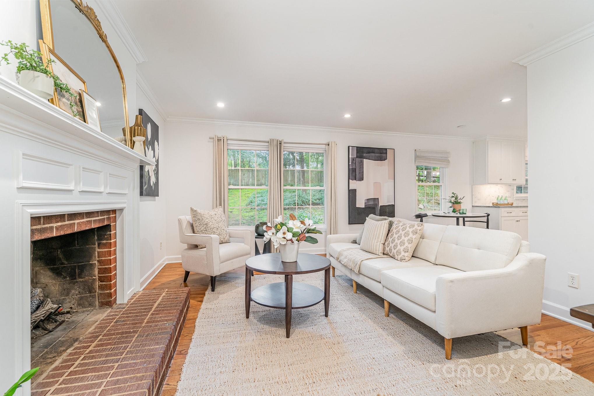 6749 Windyrush Road Charlotte, NC 28226 - Photo 17 of 30 a living room with furniture and a fireplace