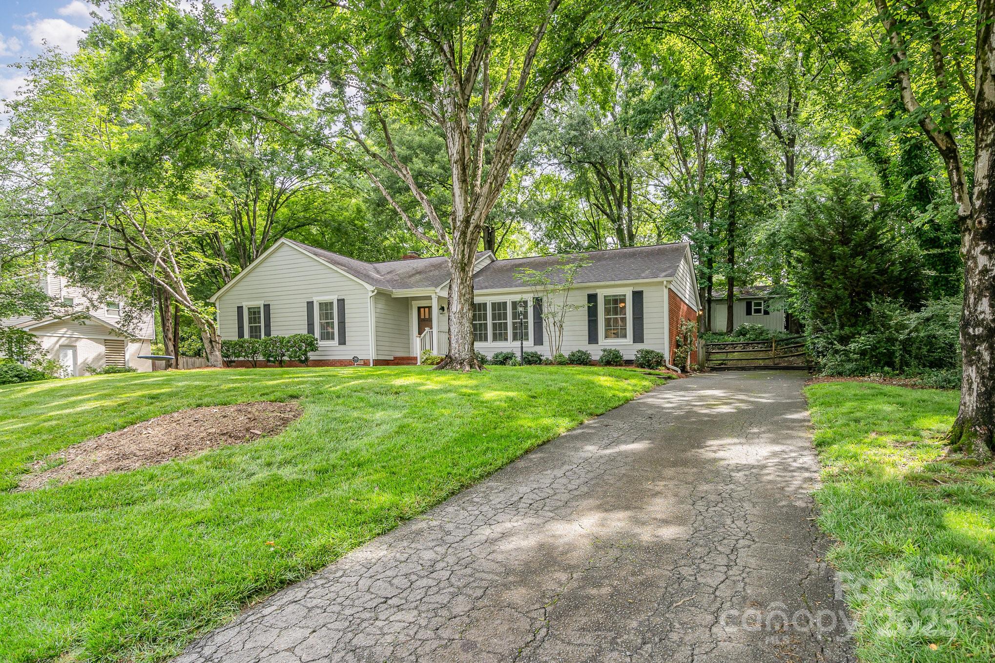 6749 Windyrush Road Charlotte, NC 28226 - Photo 2 of 30 a view of house with a yard