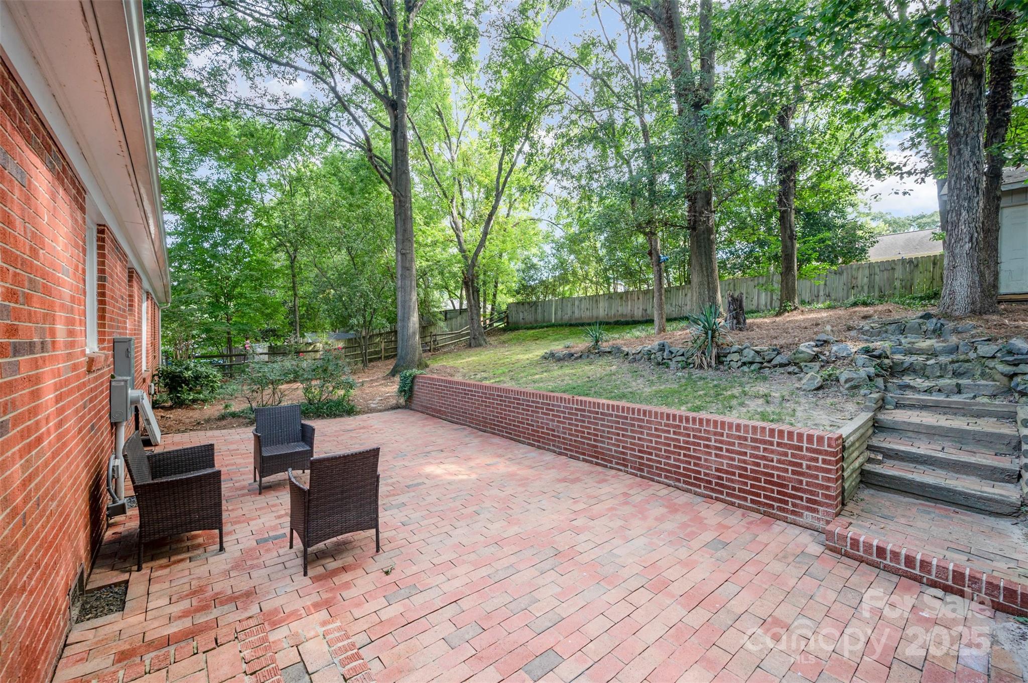 6749 Windyrush Road Charlotte, NC 28226 - Photo 26 of 30 a backyard of a house with outdoor seating