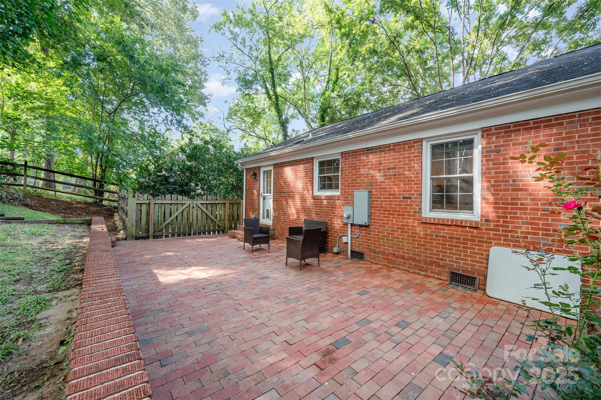 6749 Windyrush Road Charlotte, NC 28226 - Photo 27 of 30 a view of backyard with a patio and wooden fence