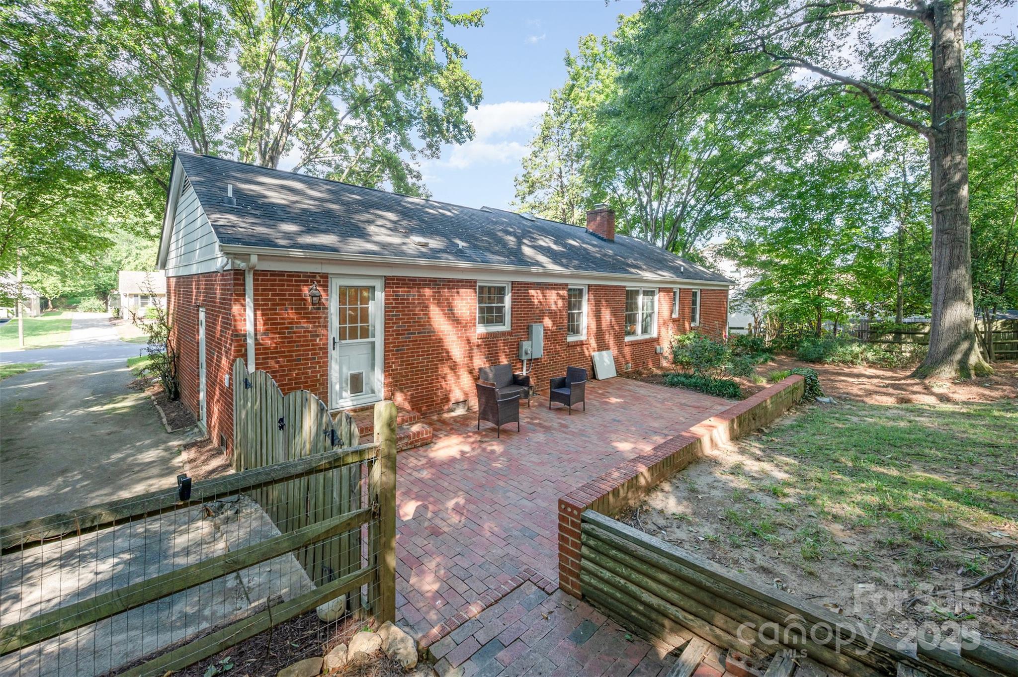 6749 Windyrush Road Charlotte, NC 28226 - Photo 28 of 30 a view of a backyard with sitting area