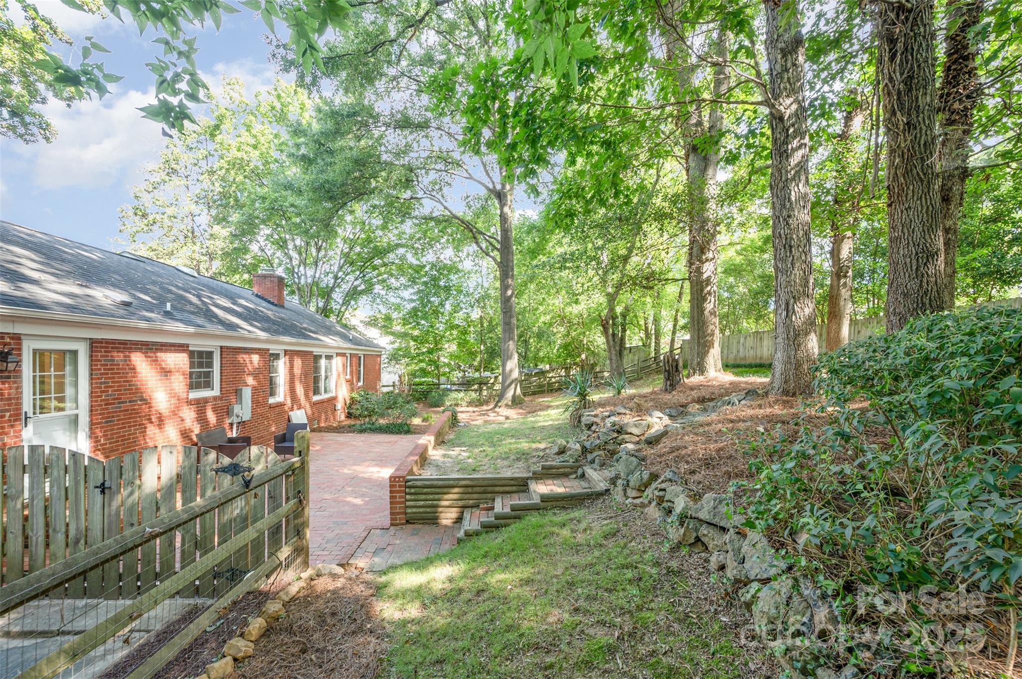 6749 Windyrush Road Charlotte, NC 28226 - Photo 29 of 30 a backyard of a house with seating space