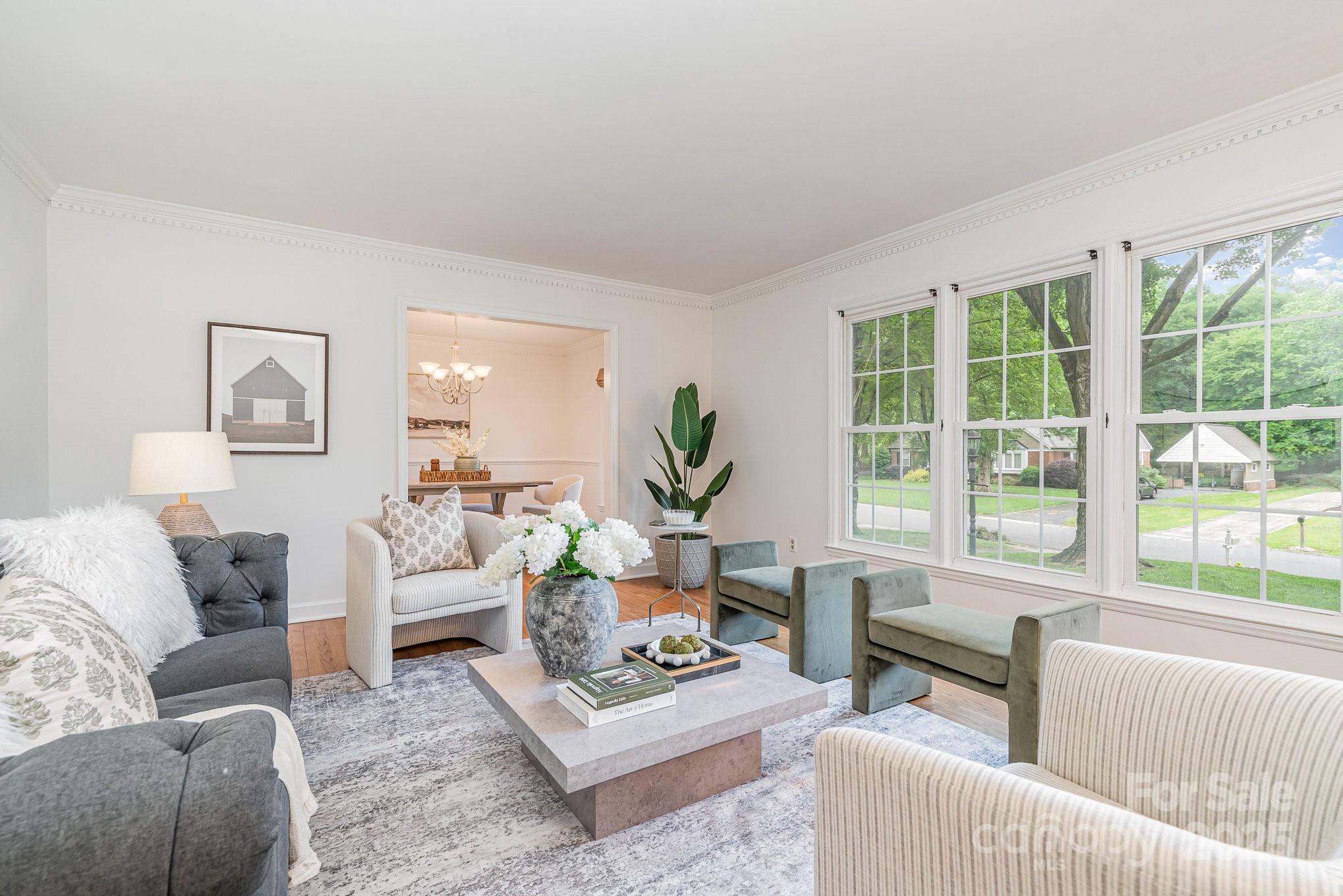6749 Windyrush Road Charlotte, NC 28226 - Photo 3 of 30 a living room with furniture and a large window