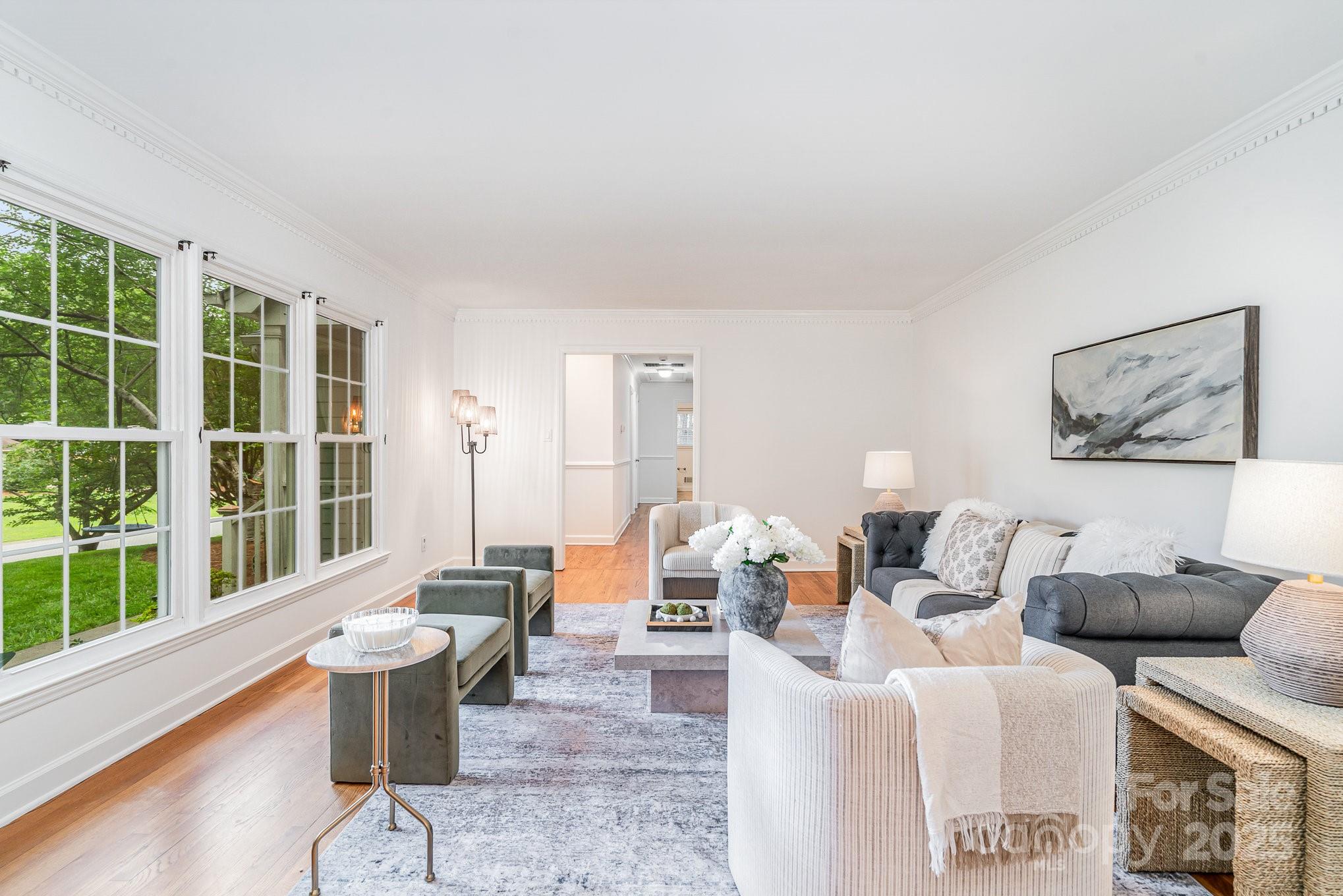 6749 Windyrush Road Charlotte, NC 28226 - Photo 5 of 30 a living room with furniture and a large window