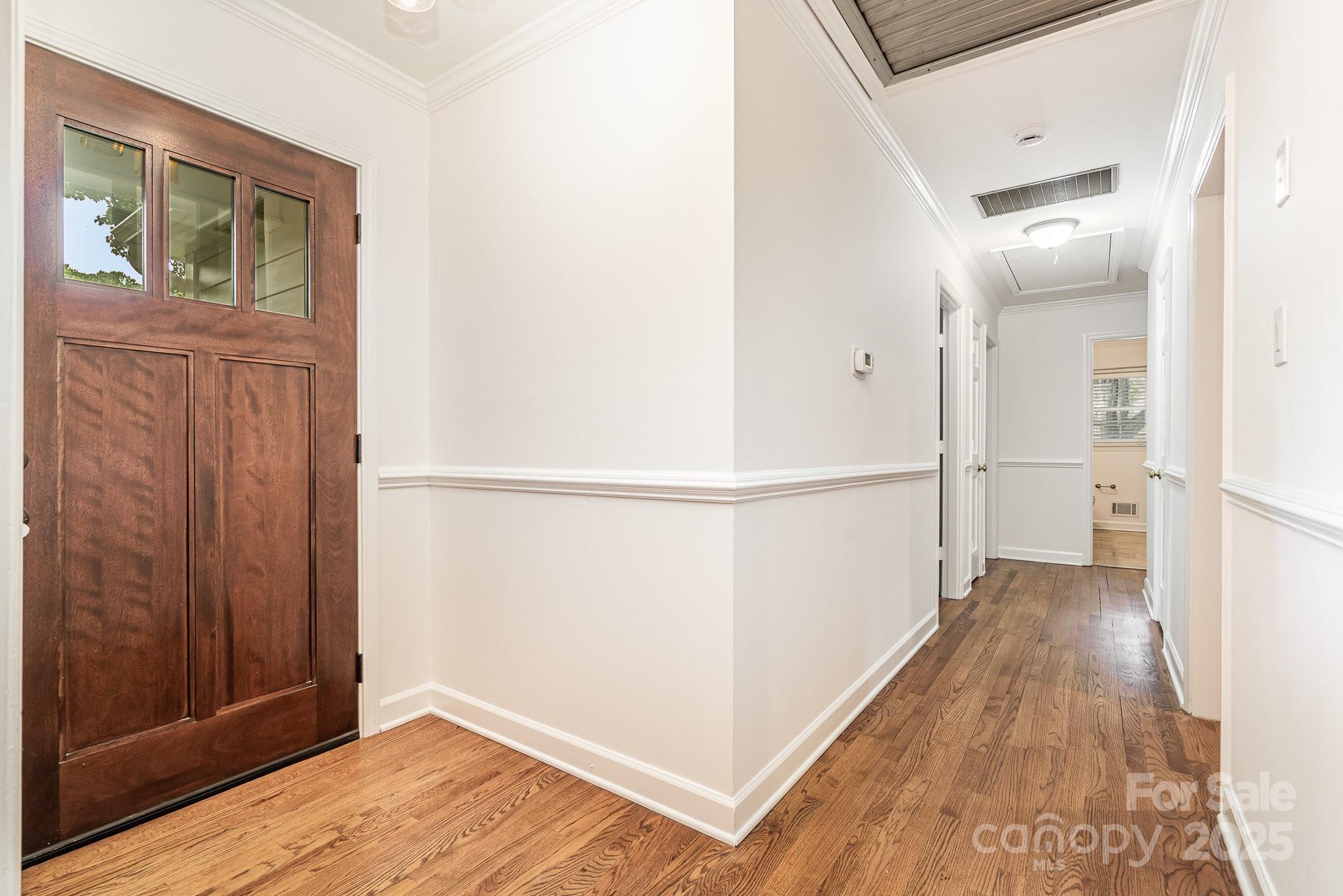 6749 Windyrush Road Charlotte, NC 28226 - Photo 6 of 30 a view of hallway with wooden floor