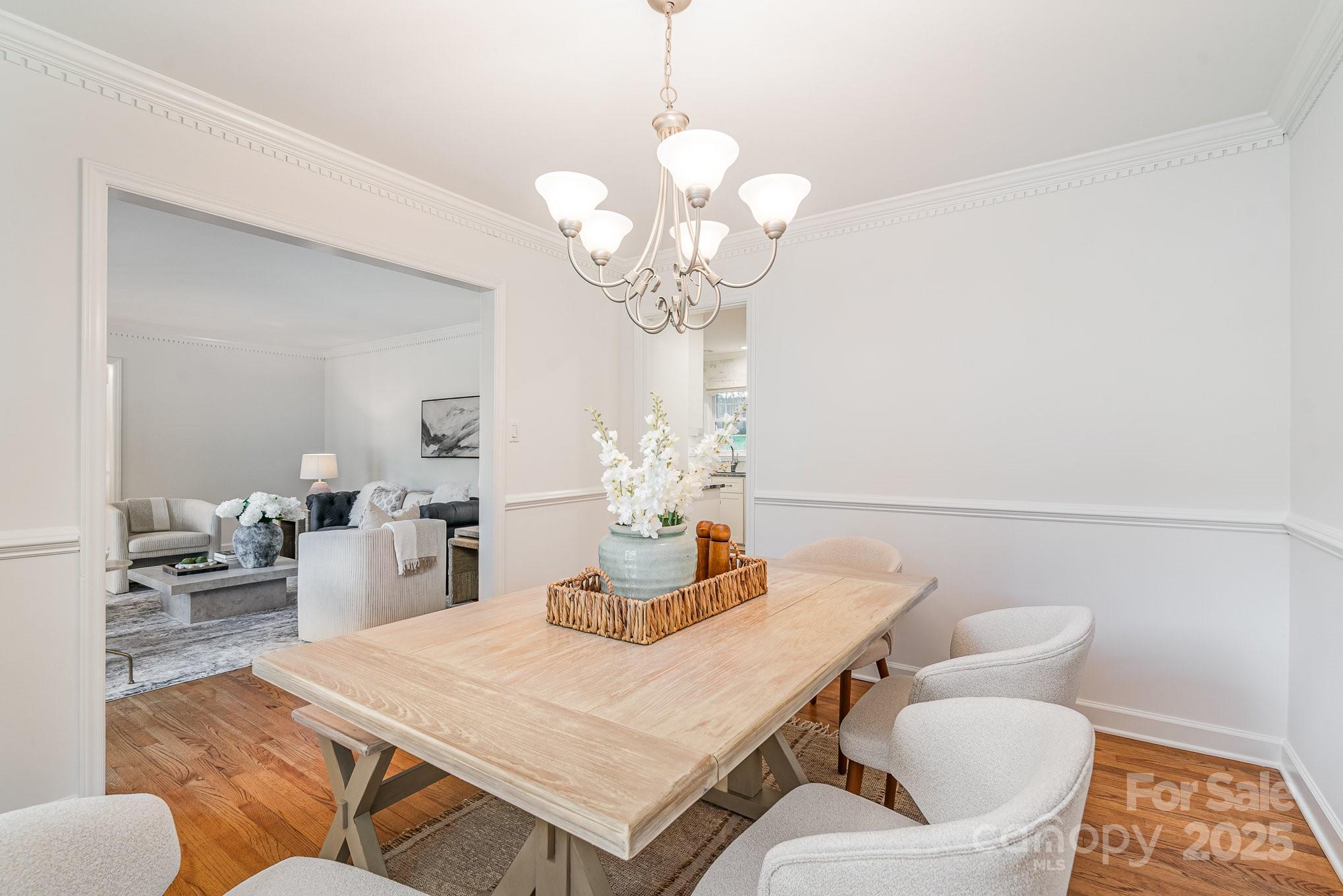 6749 Windyrush Road Charlotte, NC 28226 - Photo 8 of 30 a view of a dining room with furniture and wooden floor