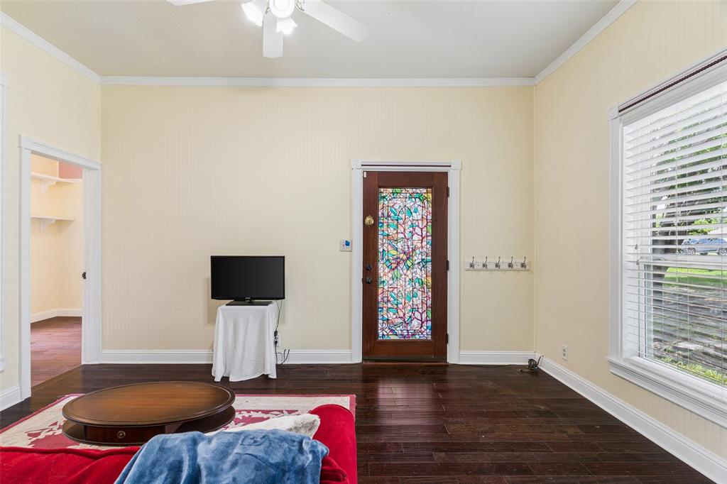 5824 Boone Street Sachse, TX 75048 - Photo 4 of 40 a bedroom with furniture and a wooden floor