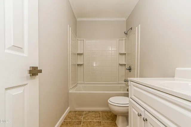 a bathroom with a toilet sink and shower