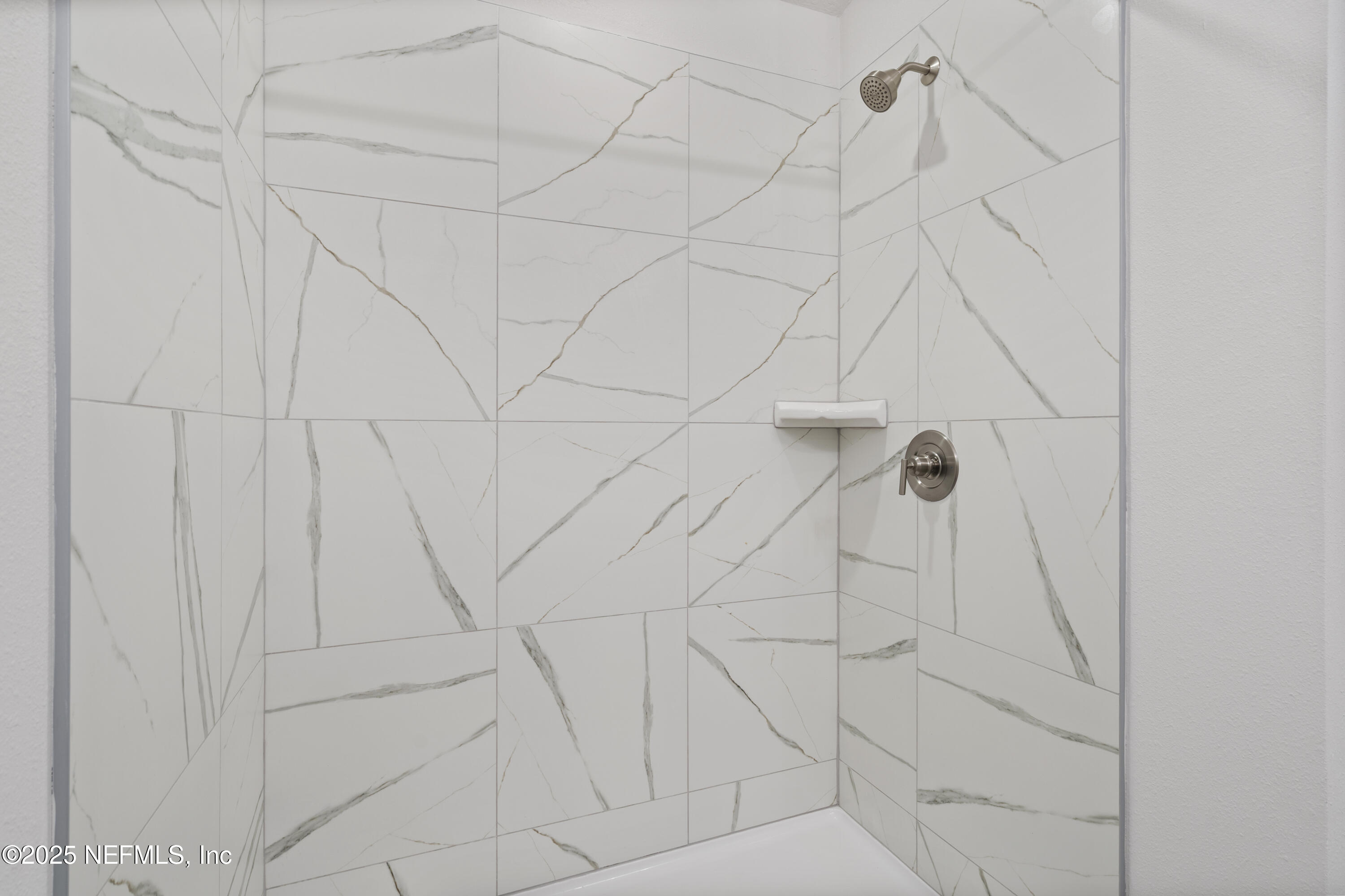 8346 Helmsley Boulevard Jacksonville, FL 32219 - Photo 10 of 24 a bathroom with a shower