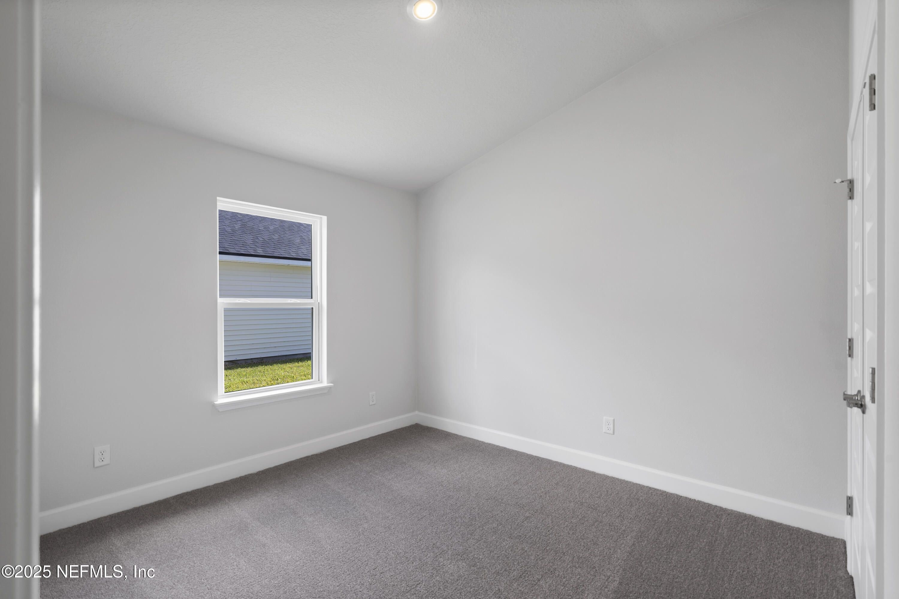 8346 Helmsley Boulevard Jacksonville, FL 32219 - Photo 12 of 24 an empty room with a window