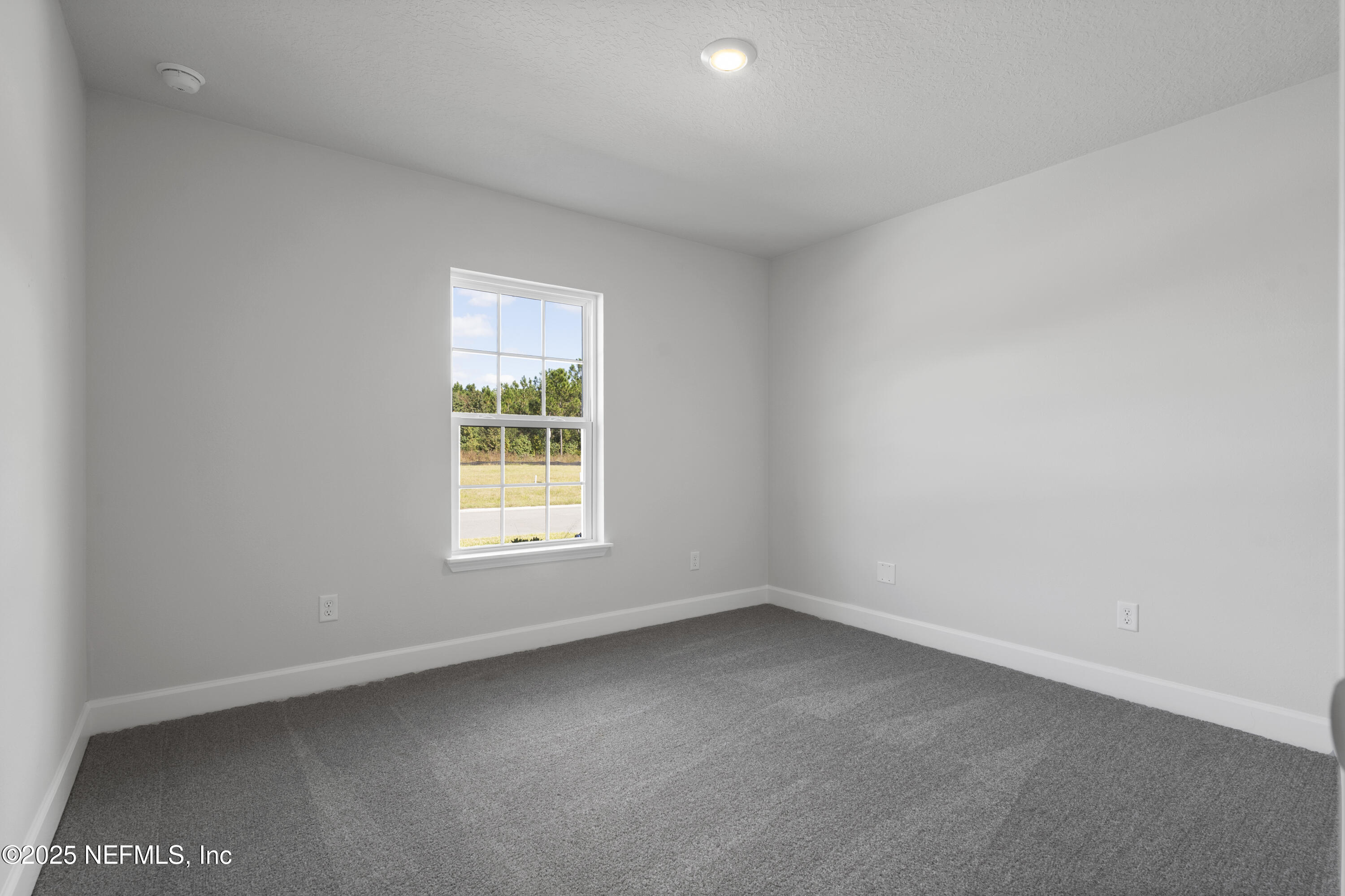 8346 Helmsley Boulevard Jacksonville, FL 32219 - Photo 14 of 24 an empty room with a window