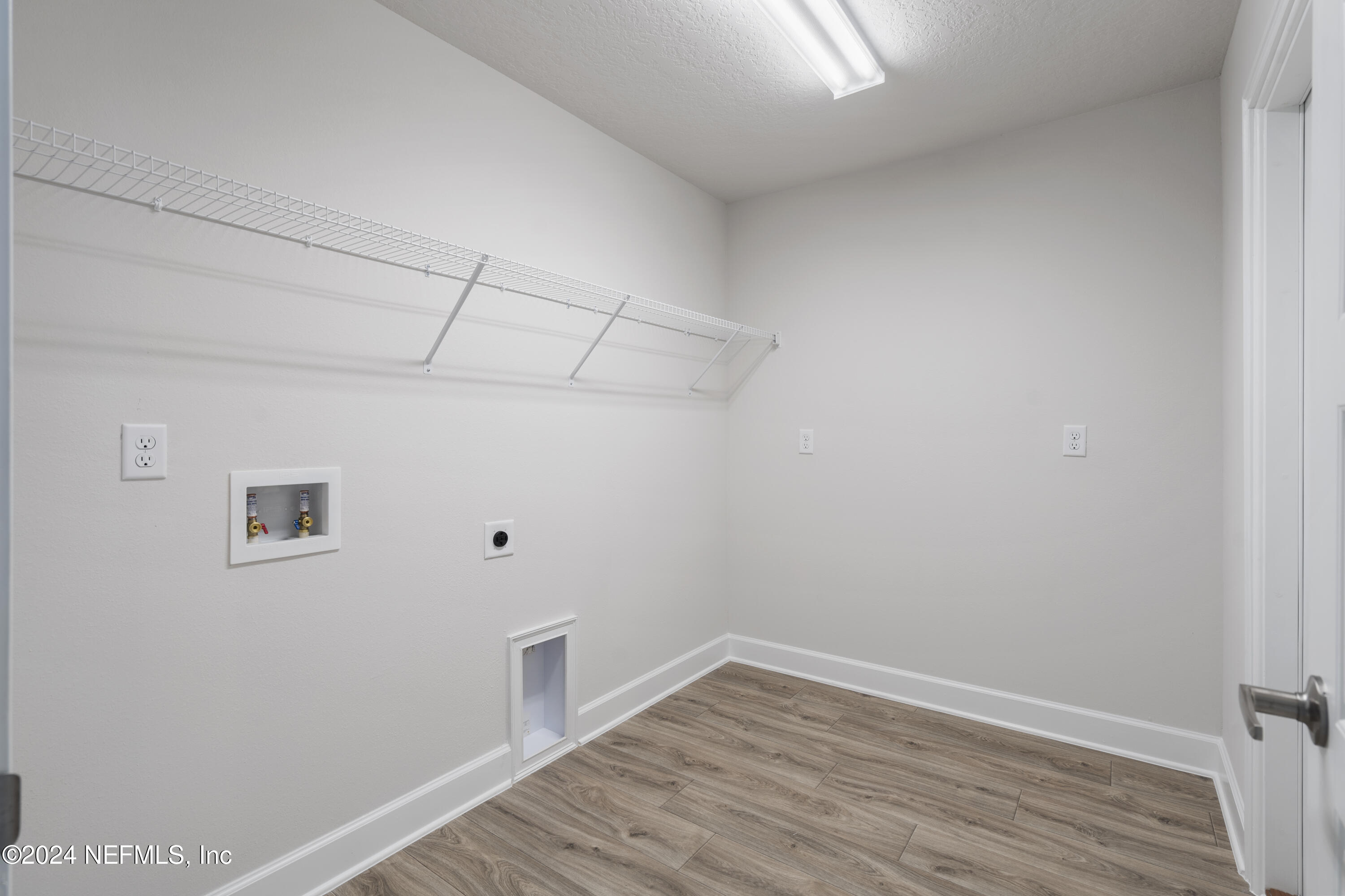 8346 Helmsley Boulevard Jacksonville, FL 32219 - Photo 15 of 24 a view of a room with wooden floor