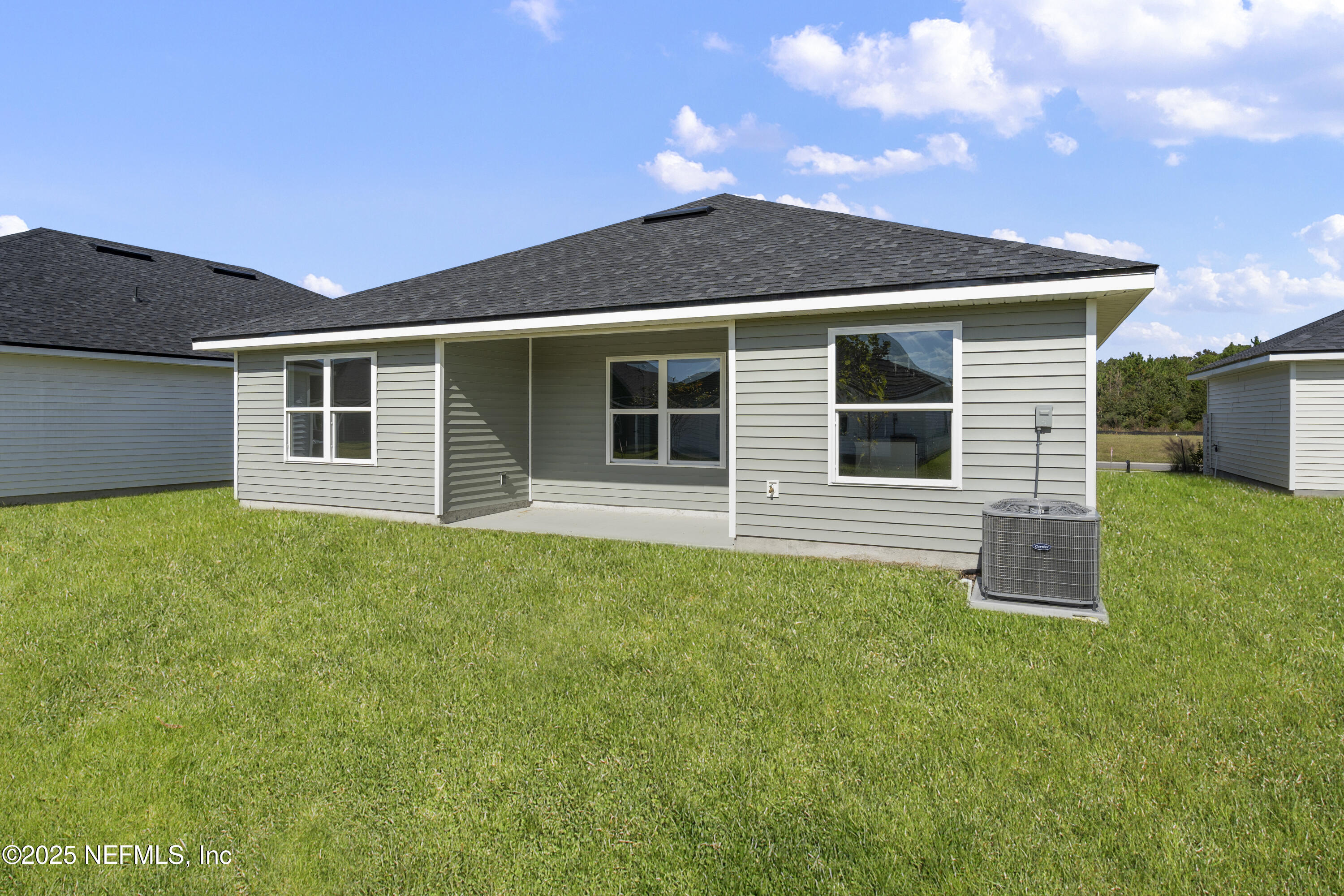 8346 Helmsley Boulevard Jacksonville, FL 32219 - Photo 16 of 24 a front view of a house with a garden