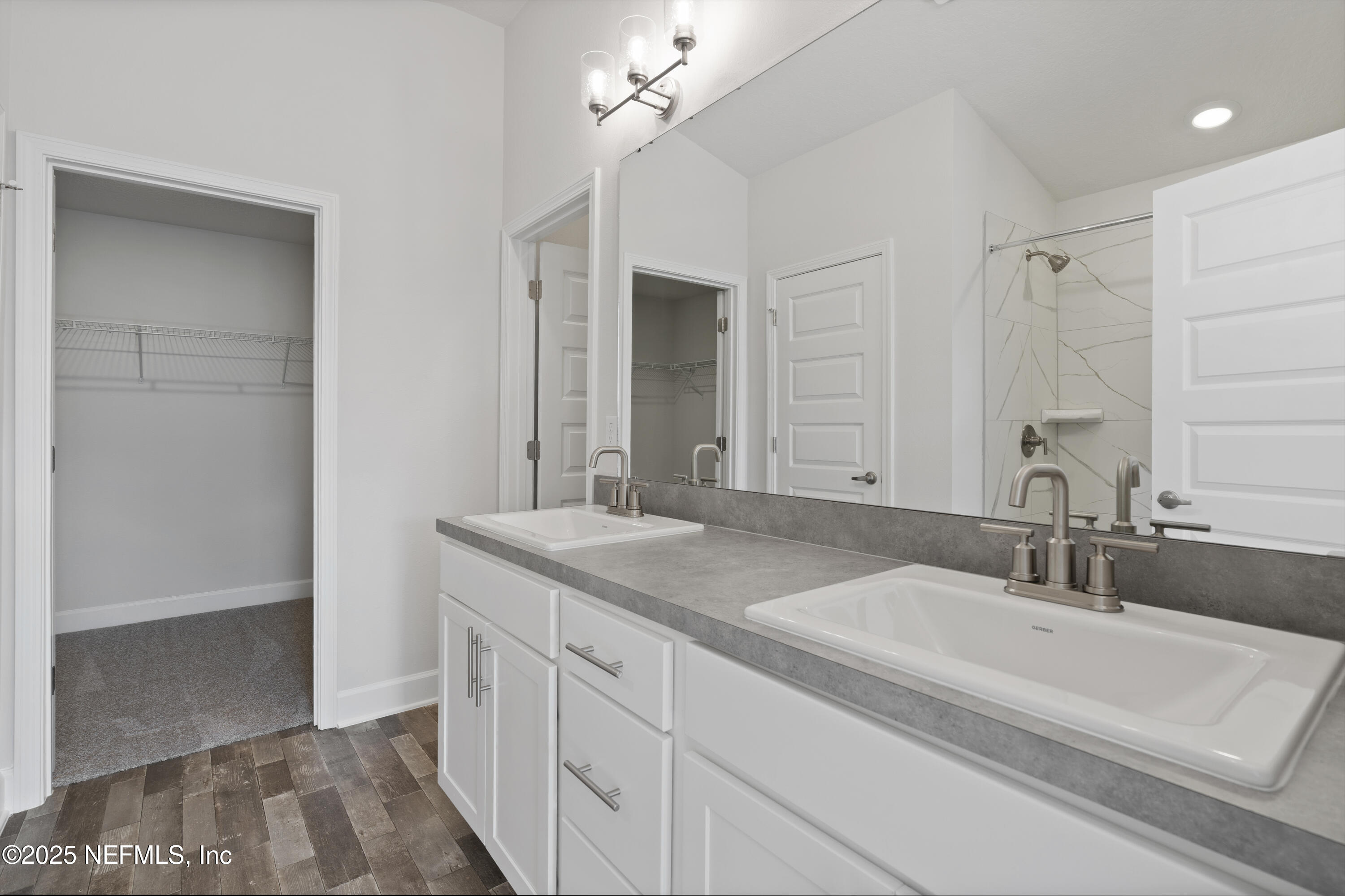 8346 Helmsley Boulevard Jacksonville, FL 32219 - Photo 9 of 24 a bathroom with a sink and a mirror