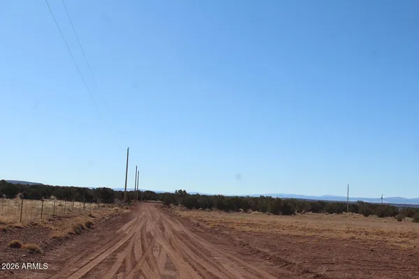 a view of mountains and sunset