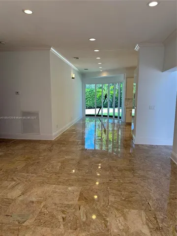 a room with a dresser and a window