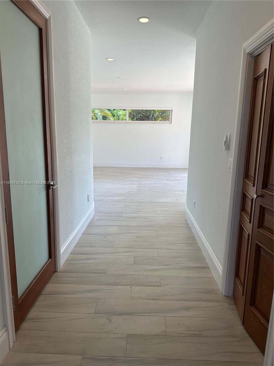 10600 Southwest 69th Avenue Pinecrest, FL 33156 - Photo 26 of 55 a view of an empty room and a window