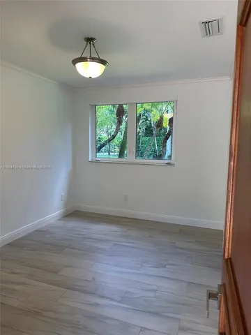 a bathroom with a double vanity sink a mirror and a shower