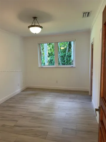 a bathroom with a shower and toilet