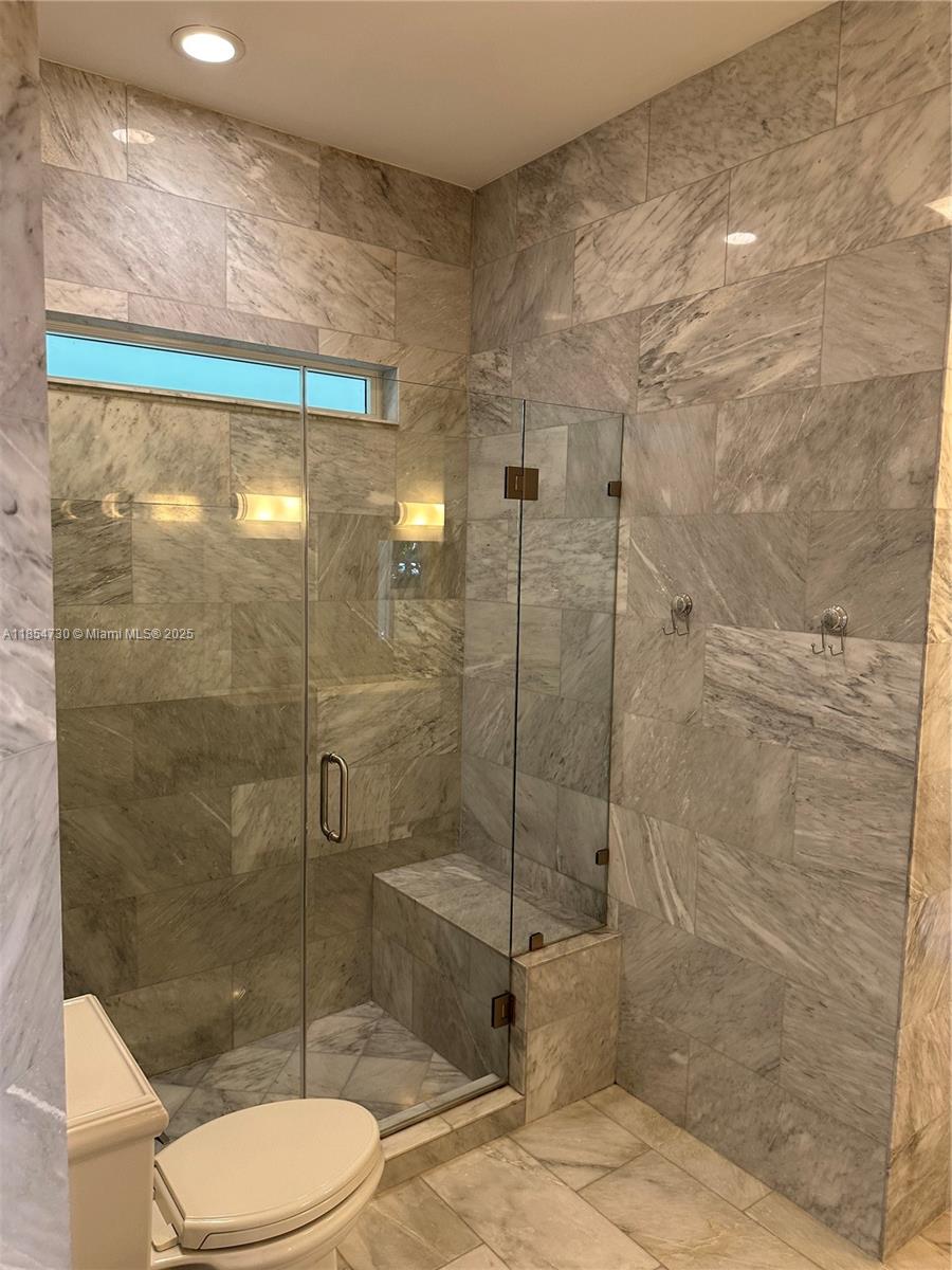 10600 Southwest 69th Avenue Pinecrest, FL 33156 - Photo 37 of 55 a bathroom with a shower and toilet