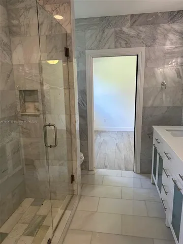 a yellow house with a outdoor space