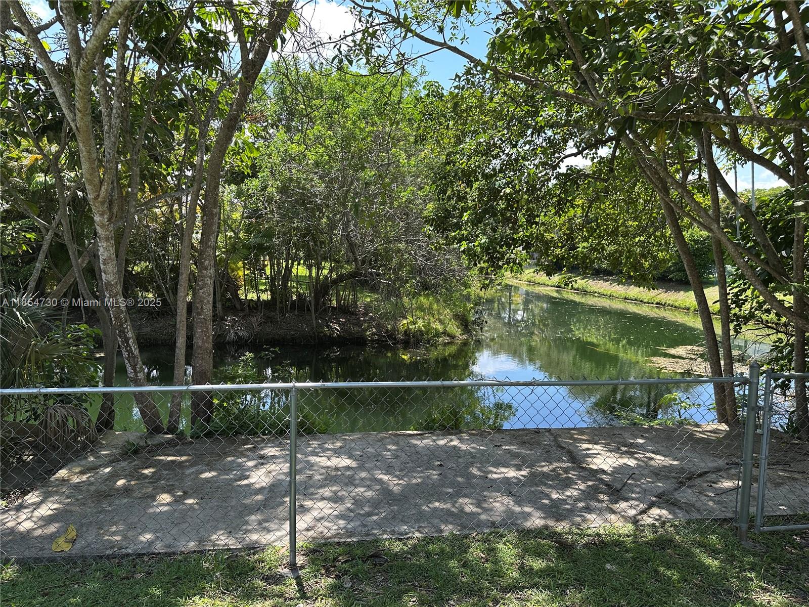 10600 Southwest 69th Avenue Pinecrest, FL 33156 - Photo 47 of 55 a view of a yard with large trees