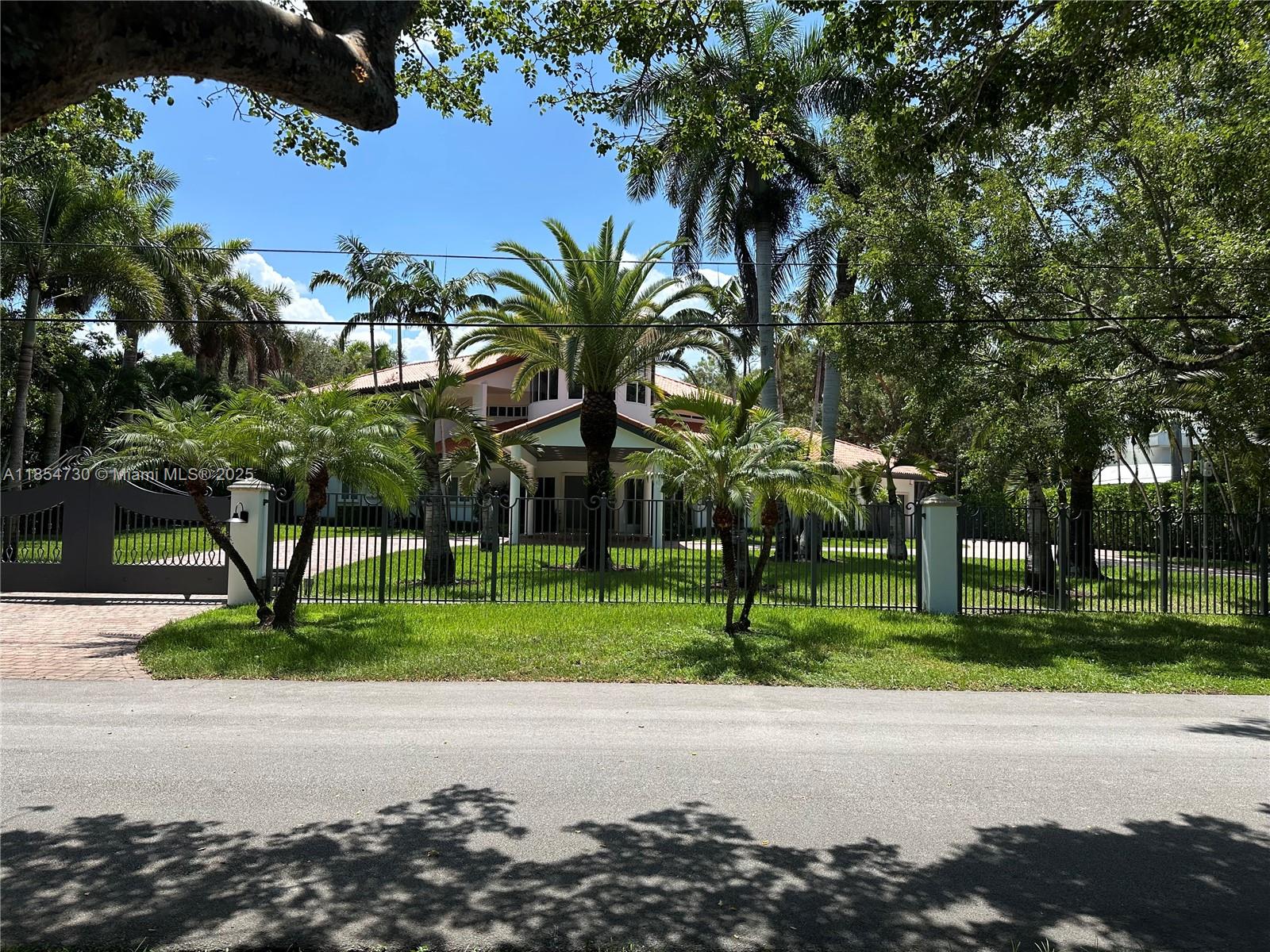 10600 Southwest 69th Avenue Pinecrest, FL 33156 - Photo 49 of 55 a view of road and trees