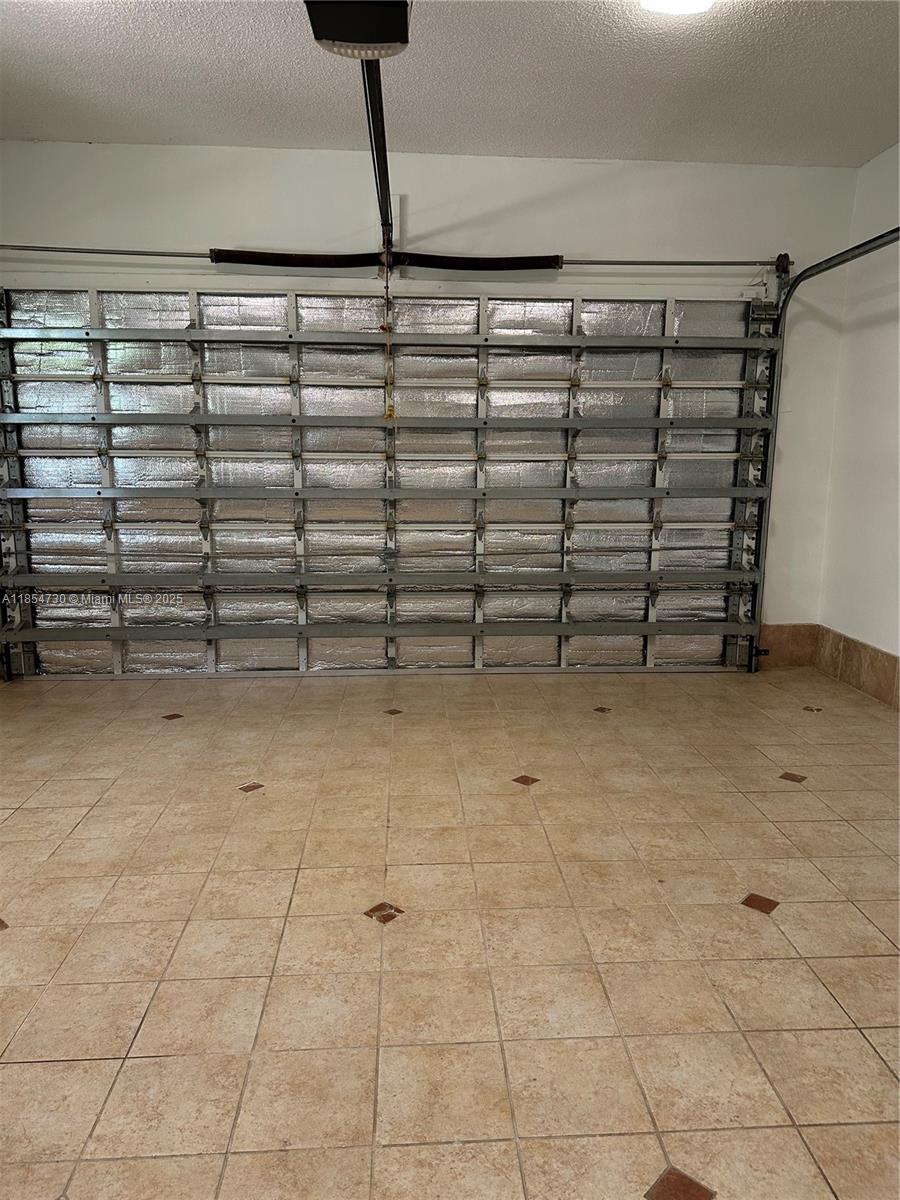 10600 Southwest 69th Avenue Pinecrest, FL 33156 - Photo 54 of 55 a view of a room with racks on the wall