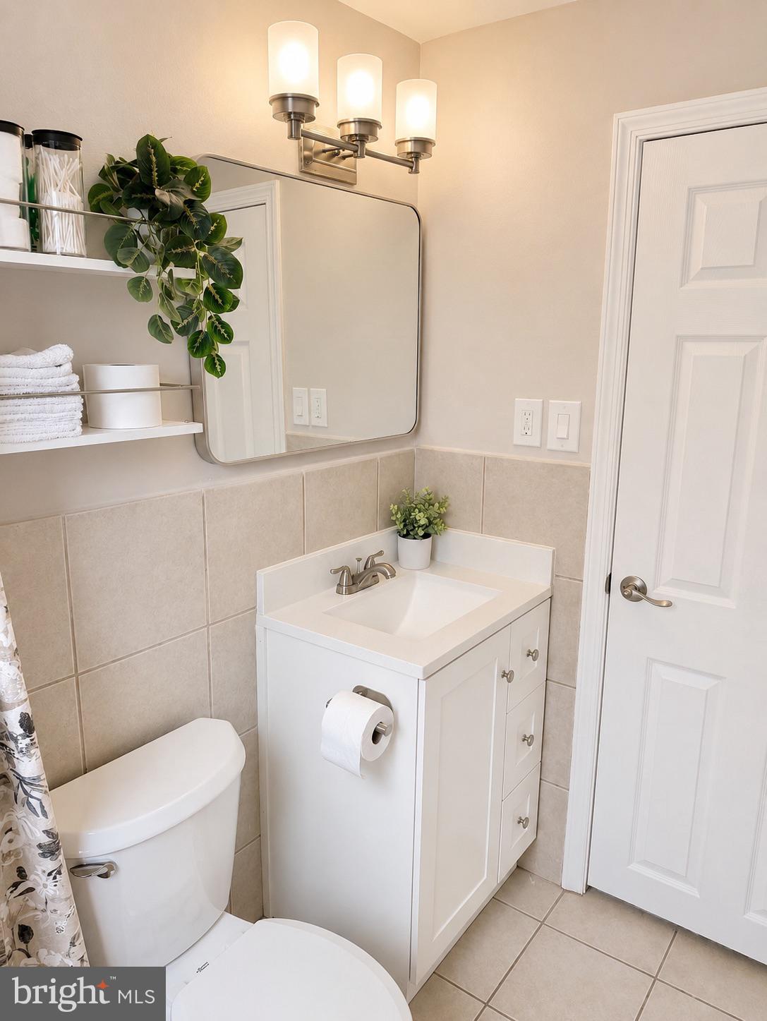 2235 Southorn Road Baltimore, MD 21220 - Photo 19 of 33 a bathroom with a sink toilet and vanity