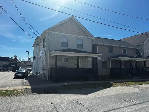 a view of a house with a street