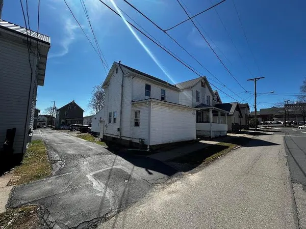a view of a car park in front of house