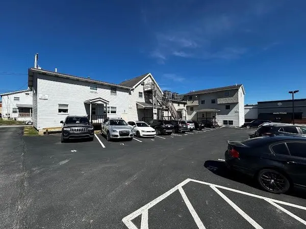 a view of a city street with cars